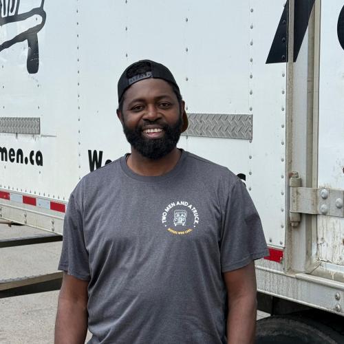 Anthony by moving truck.