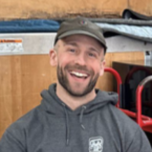 employee pictured inside moving truck next
